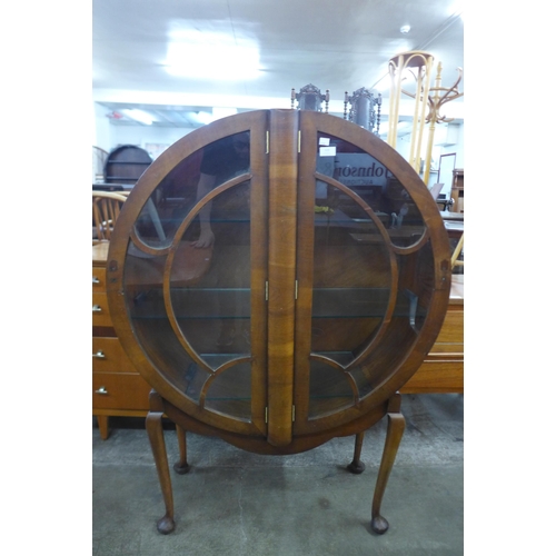 123 - An Art Deco circular walnut display cabinet