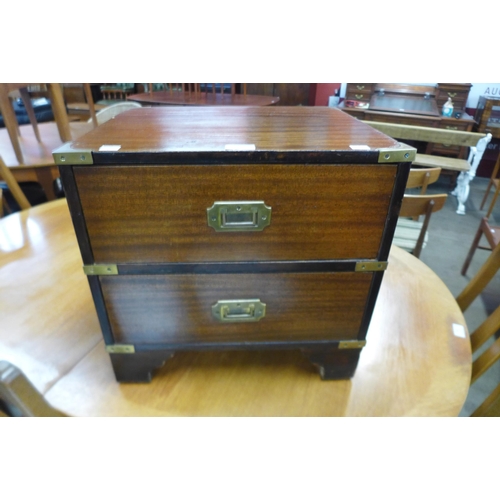 125 - A small campaign style mahogany chest