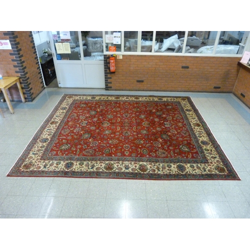 139 - An early 20th Century Persian red ground Tabriz rug, 396 x 335cms