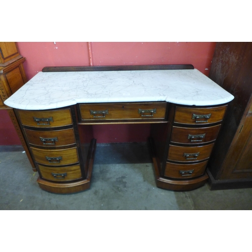 146 - A Victorian mahogany and marble topped washstand
