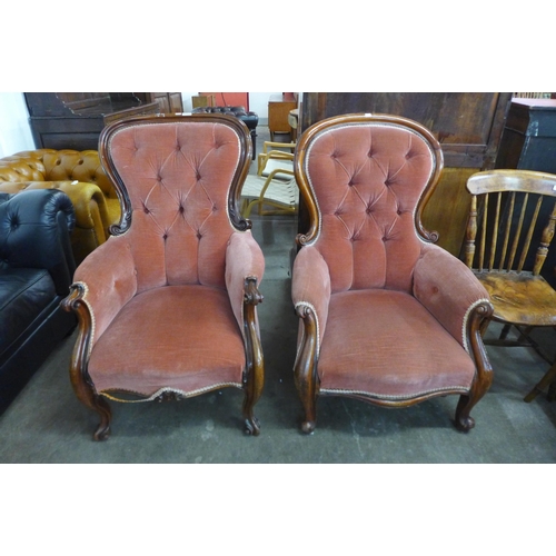 148 - A pair of Victorian carved mahogany and fabric upholstered button-back armchairs
