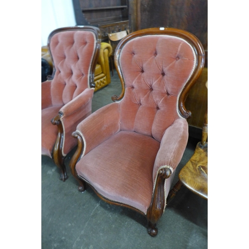 148 - A pair of Victorian carved mahogany and fabric upholstered button-back armchairs