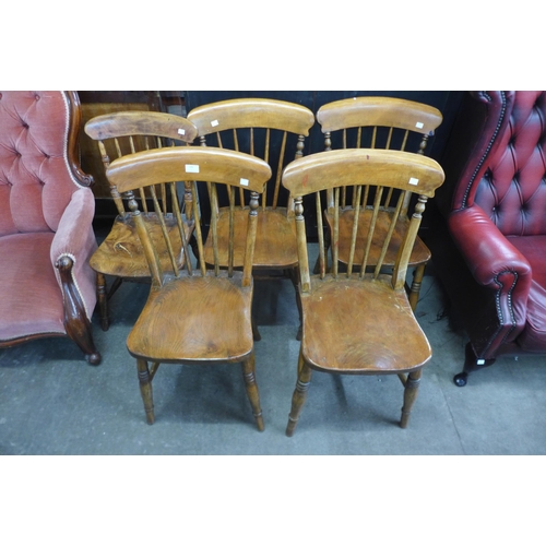 149 - A set of four Victorian elm and beech kitchen chairs and another similar