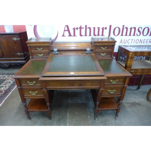 15 - A Victorian walnut and green leather topped Dickens desk, made by Charles Gregory & Co., Regent Stre... 