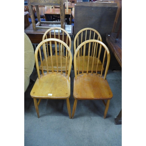158 - A set of four beech stick-back kitchen chairs