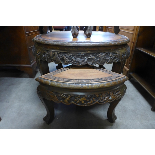 170 - A Chinese carved hardwood circular nest of tables