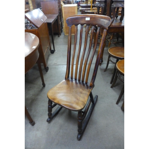 175 - A Victorian elm and beech rocking chair