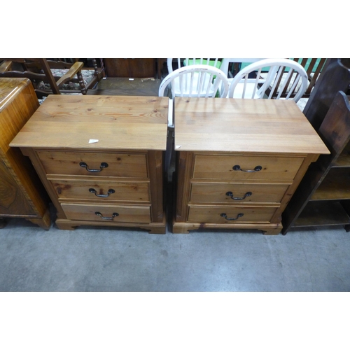 184 - A pair of pine three drawer chests