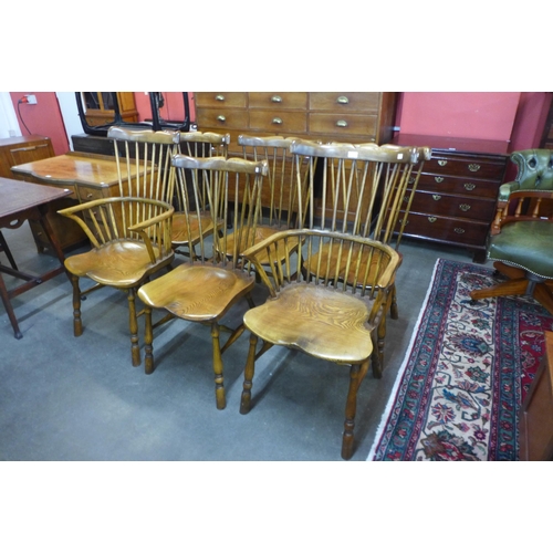 19 - A set of six primitive style elm stick-back Windsor chairs