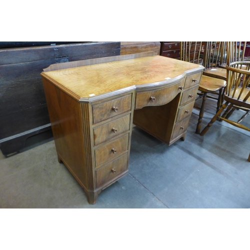 21 - An Art Deco figured walnut desk