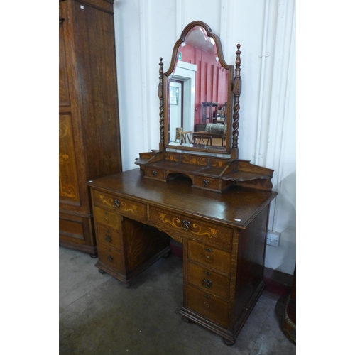 23 - A Shapland & Petter of Barnstaple Art Nouveau inlaid oak two piece bedroom suite