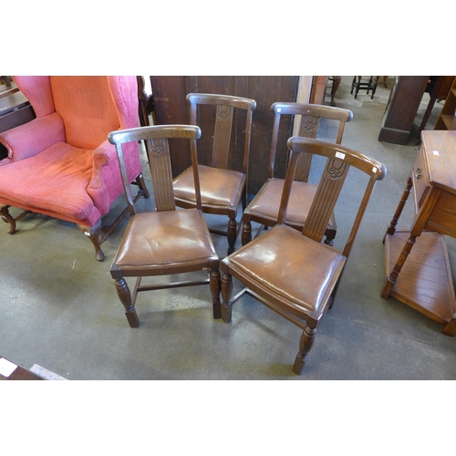 231 - A set of four oak dining chairs