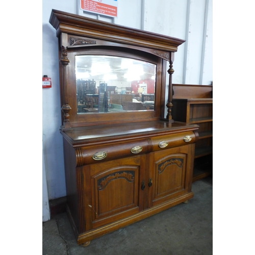 256 - An Edward VII walnut mirrorback sideboard