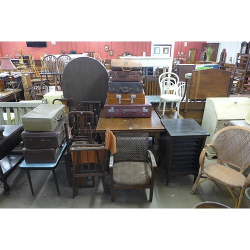 275 - An oak draw-leaf table, chairs, cases, etc.