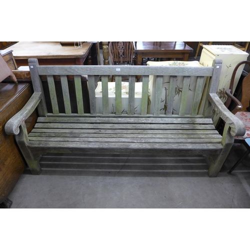 294 - A teak garden bench