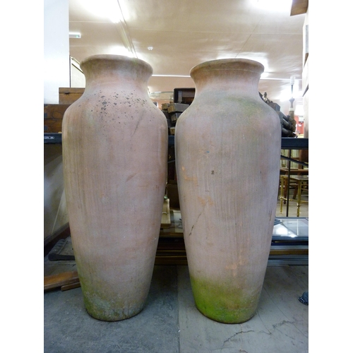 313 - A pair of large terracotta garden urns,  97cms h