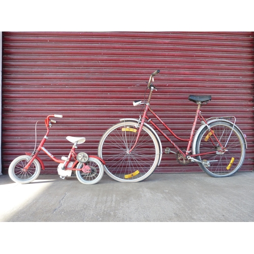 331 - A vintage Dutch lady's bicycle and a child's bicycle with stabilisers