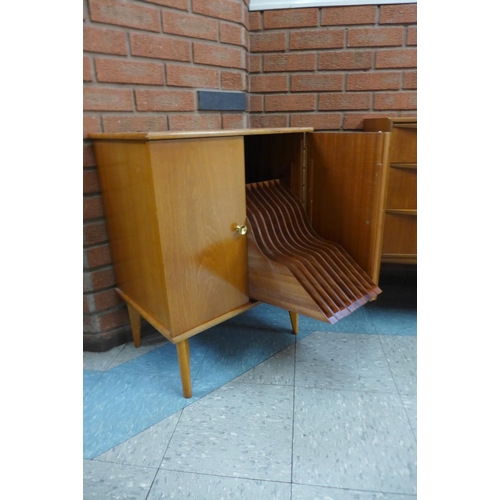 36 - A fitted teak record cabinet