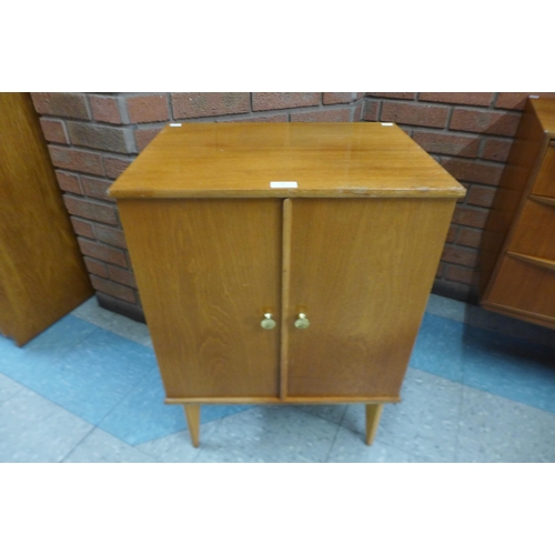 36 - A fitted teak record cabinet