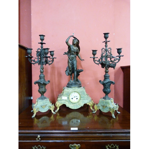 427 - A 19th Century French onyx and gilt metal figural clock garniture