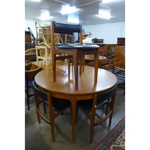 63 - A Sutcliffe of Todmorden teak extending dining table and six chairs