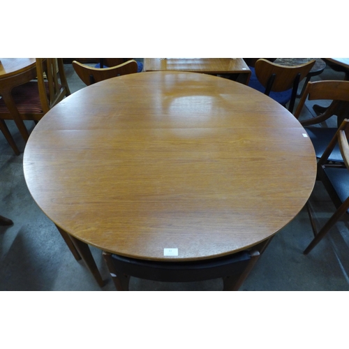 63 - A Sutcliffe of Todmorden teak extending dining table and six chairs