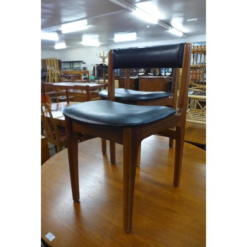 63 - A Sutcliffe of Todmorden teak extending dining table and six chairs