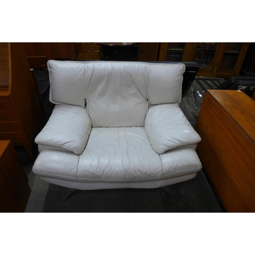 69 - A white leather and chrome armchair