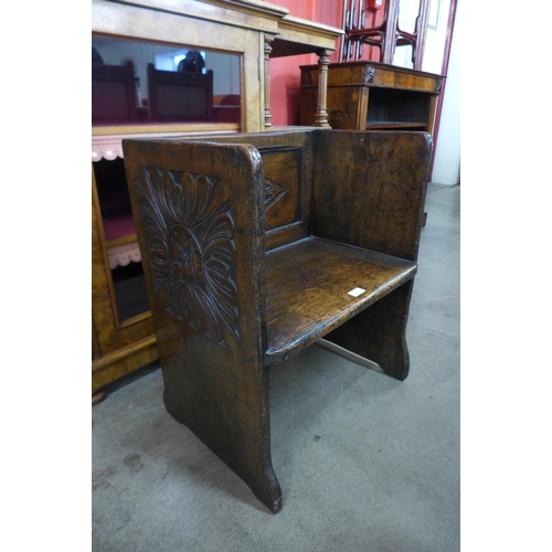 7 - A small 17th Century style carved oak box seat
