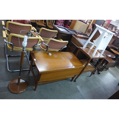 82 - A teak drop-leaf coffee table, a trolley, a teak standard lamp and one other