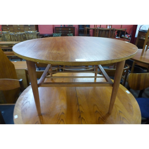 88 - A circular teak coffee table