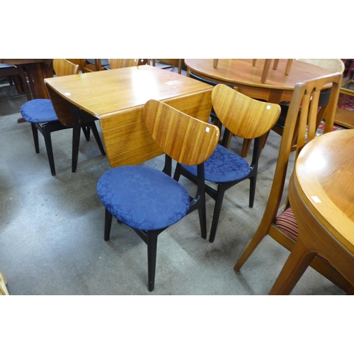 91 - A G-Plan Librenza tola wood and black drop-leaf table and four butterfly-back chairs