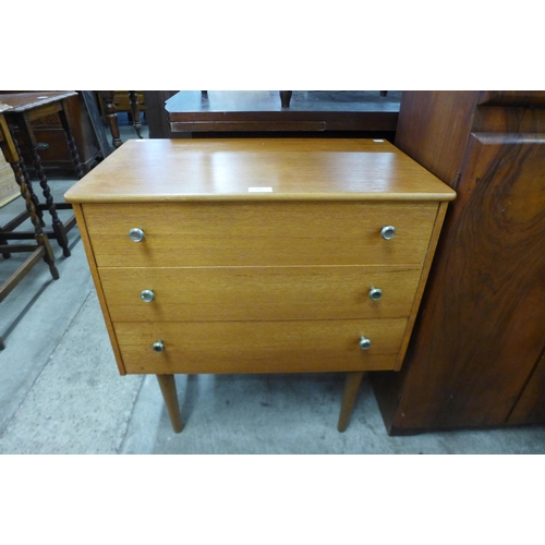 94 - A small teak chest of drawers