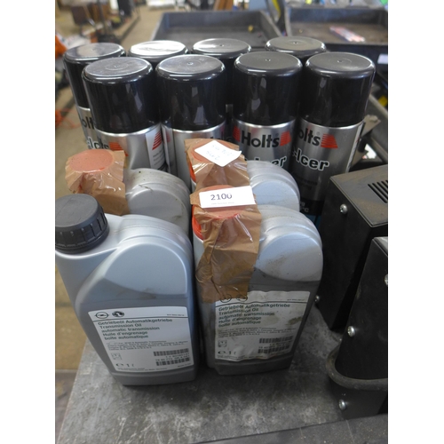 2100 - Four part bottles of transmission oil and eight cans of de-icer. This lot is subject to VAT*