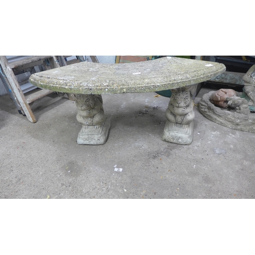 2244 - Stone curved garden bench with motif base