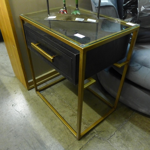 1331 - A black single drawer lamp table with gold legs and glass top