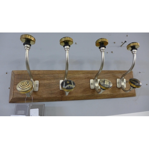 1375 - A rack of four coat hooks with ceramic knobs (HH563916)   #
