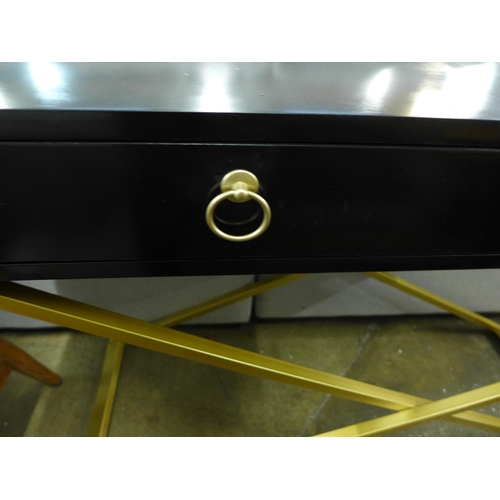 1400 - A black two drawer console table with gold legs
