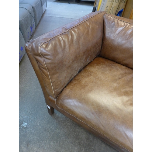 1461 - A leather upholstered two seater sofa