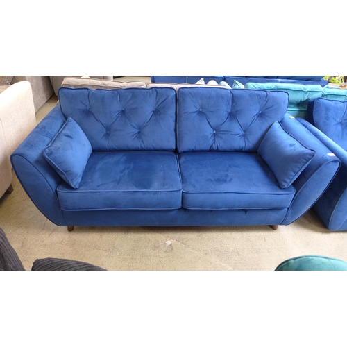 1479 - A blue velvet Hoxton three seater sofa