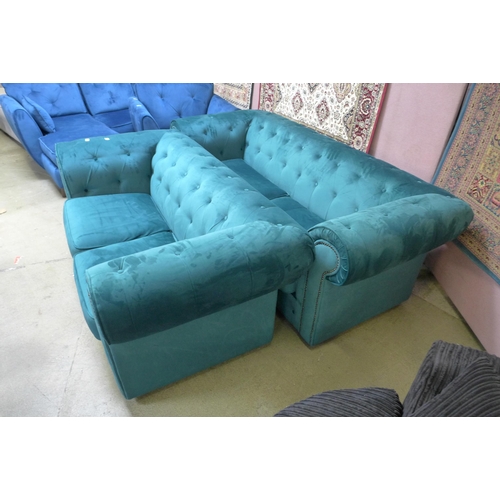 1491 - A pair of emerald velvet chesterfield sofas