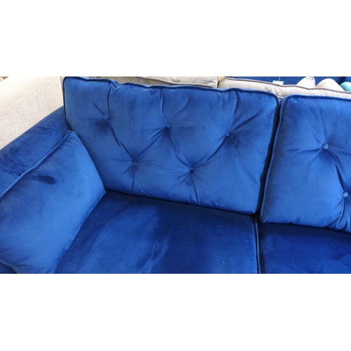 1492 - A blue velvet Hoxton three seater sofa