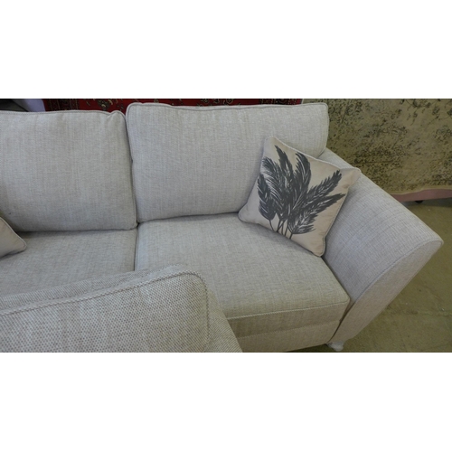 1497 - A pair of oatmeal upholstered sofas (3 + 2)