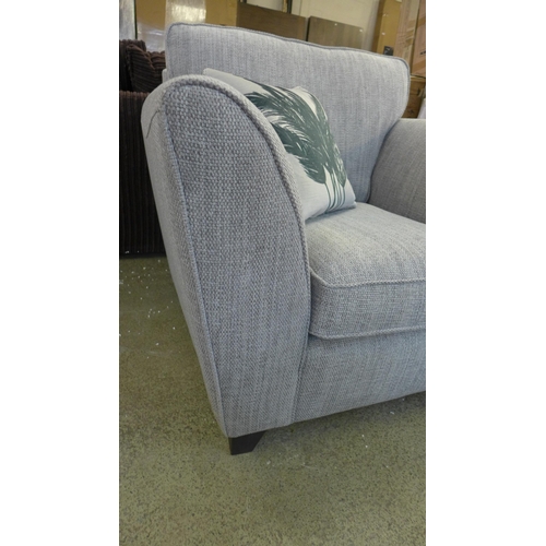 1500 - A grey upholstered armchair