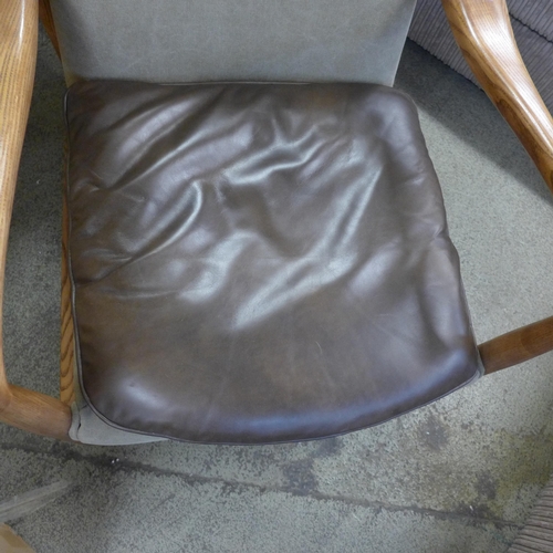 1509 - A Salisbury armchair - minor crack to leg