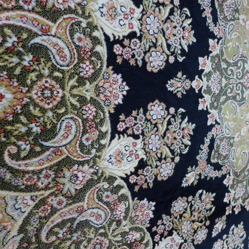 1520 - A green, black and cream silk rug, 300 x 200