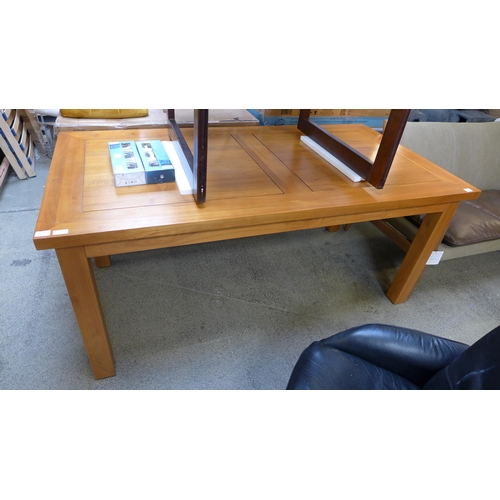 1555 - An oak effect fixed top dining table