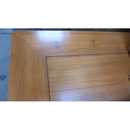 1555 - An oak effect fixed top dining table