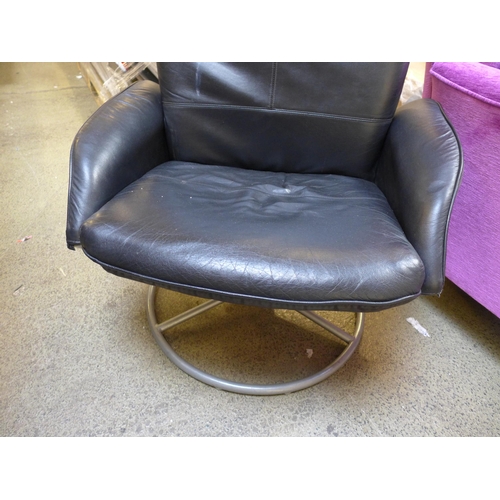 1572 - A black leather reclining armchair