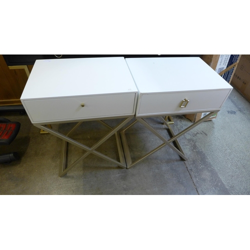 1574 - A pair of white bedside tables with cross legs